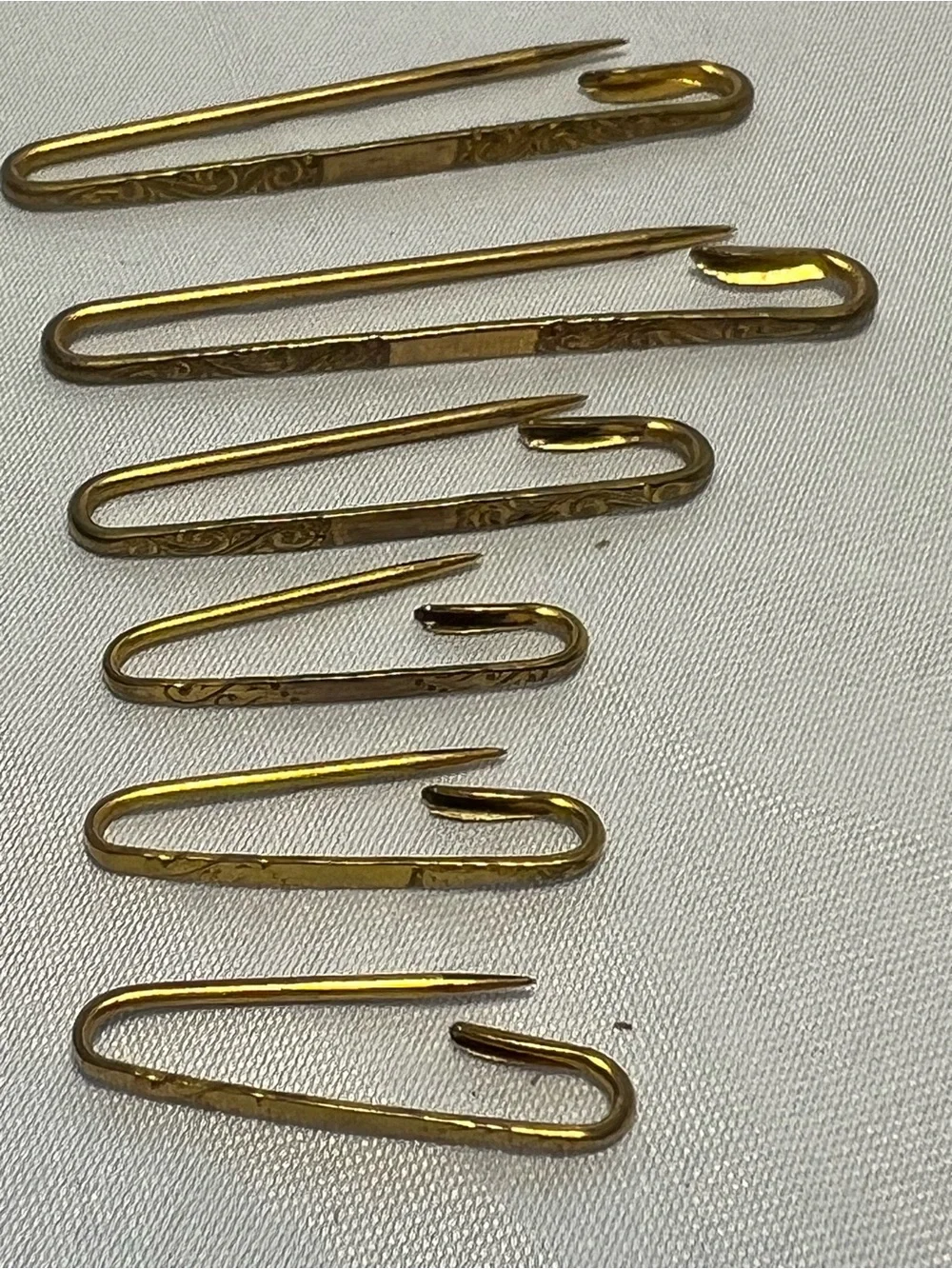 Victorian / Eduardian Era  Kilt Pin, graduated set of 6, gold tone, floral etchi